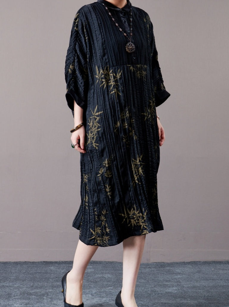 Elegant Black Pleated Maxi Dress with Golden Bamboo Motif - Image 2